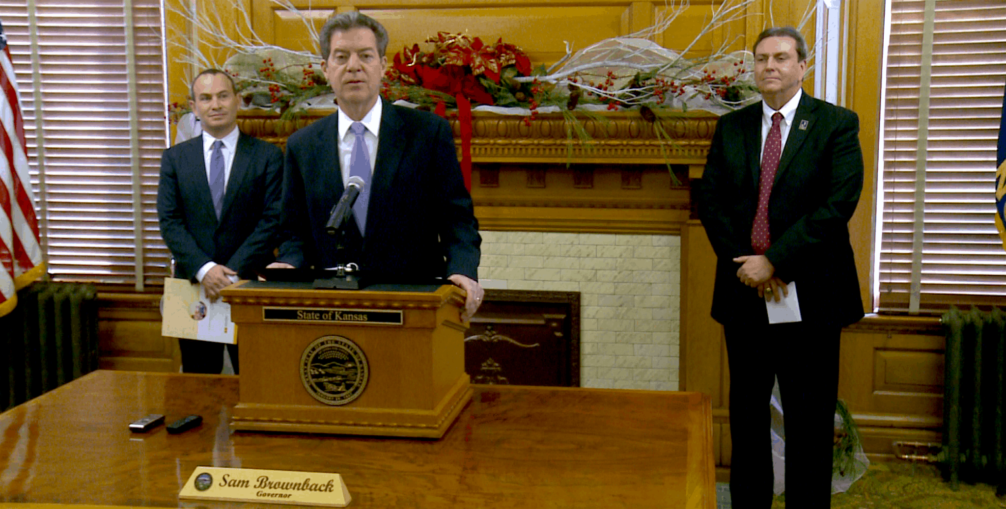 Governor Brownback at a podium