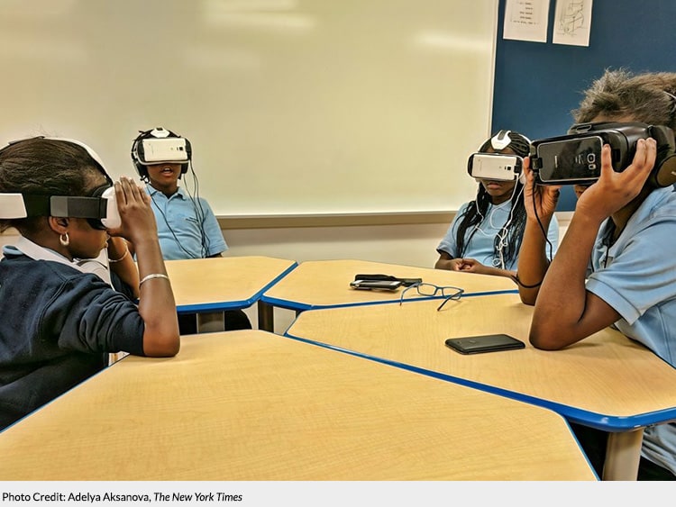 Photo of students in a class with VR glasses