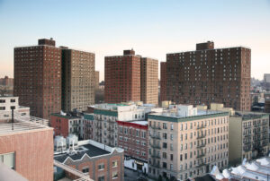 Several apartment buildings on a city block.