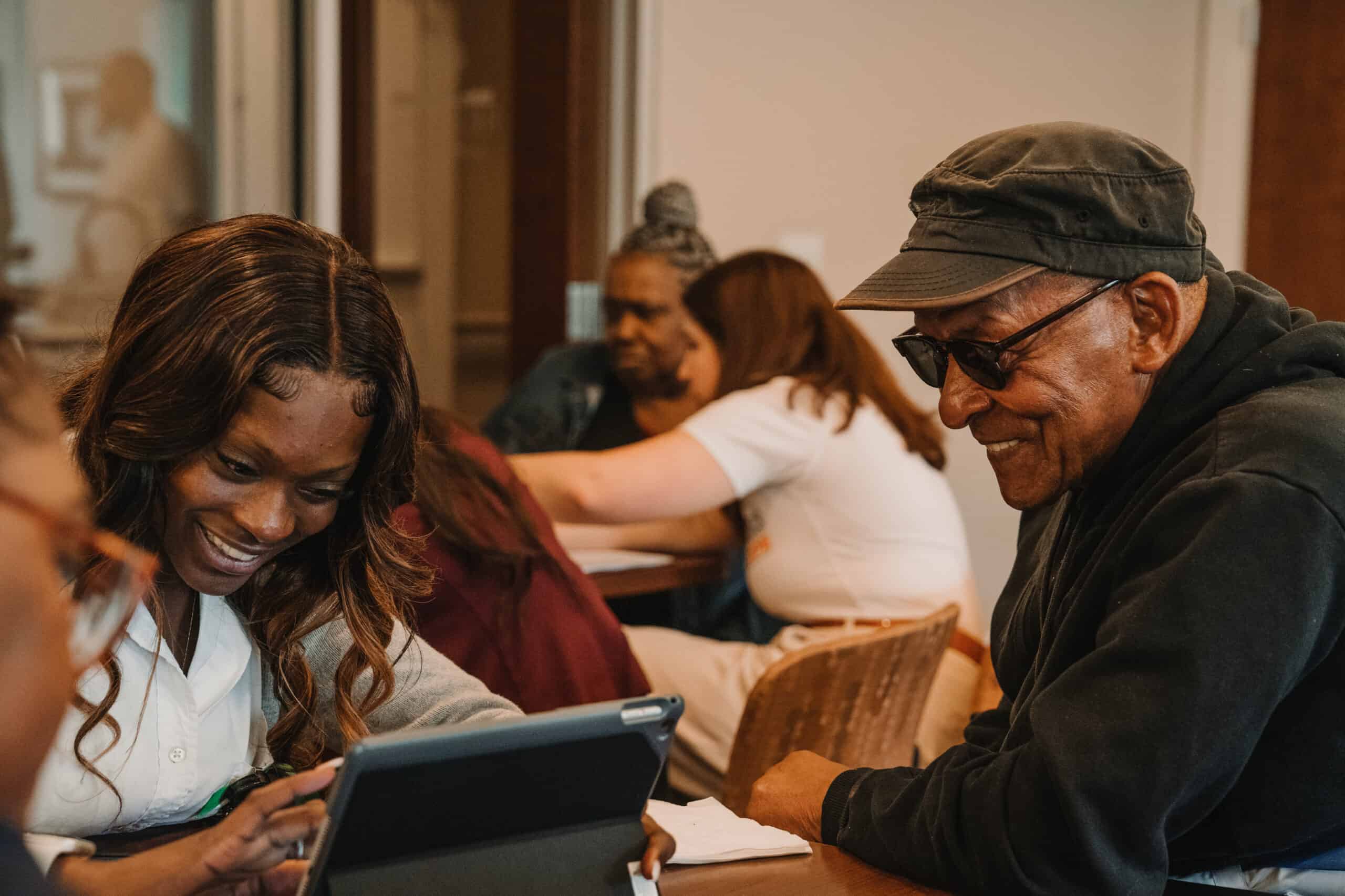 Digital Navigator assisting a resident to sign up for the ACP benefit at an enrollment event.