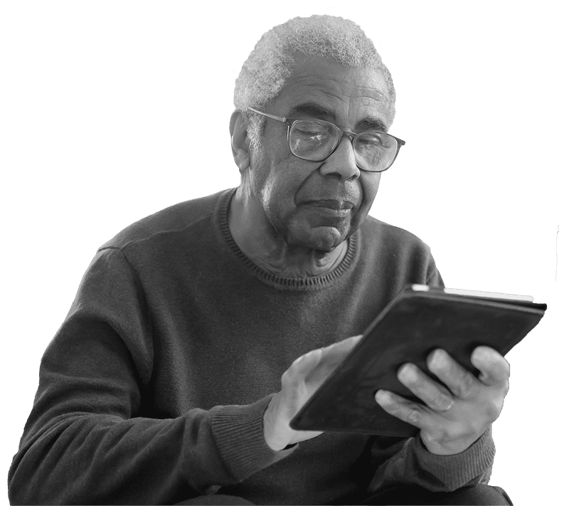 An senior male using an iPad