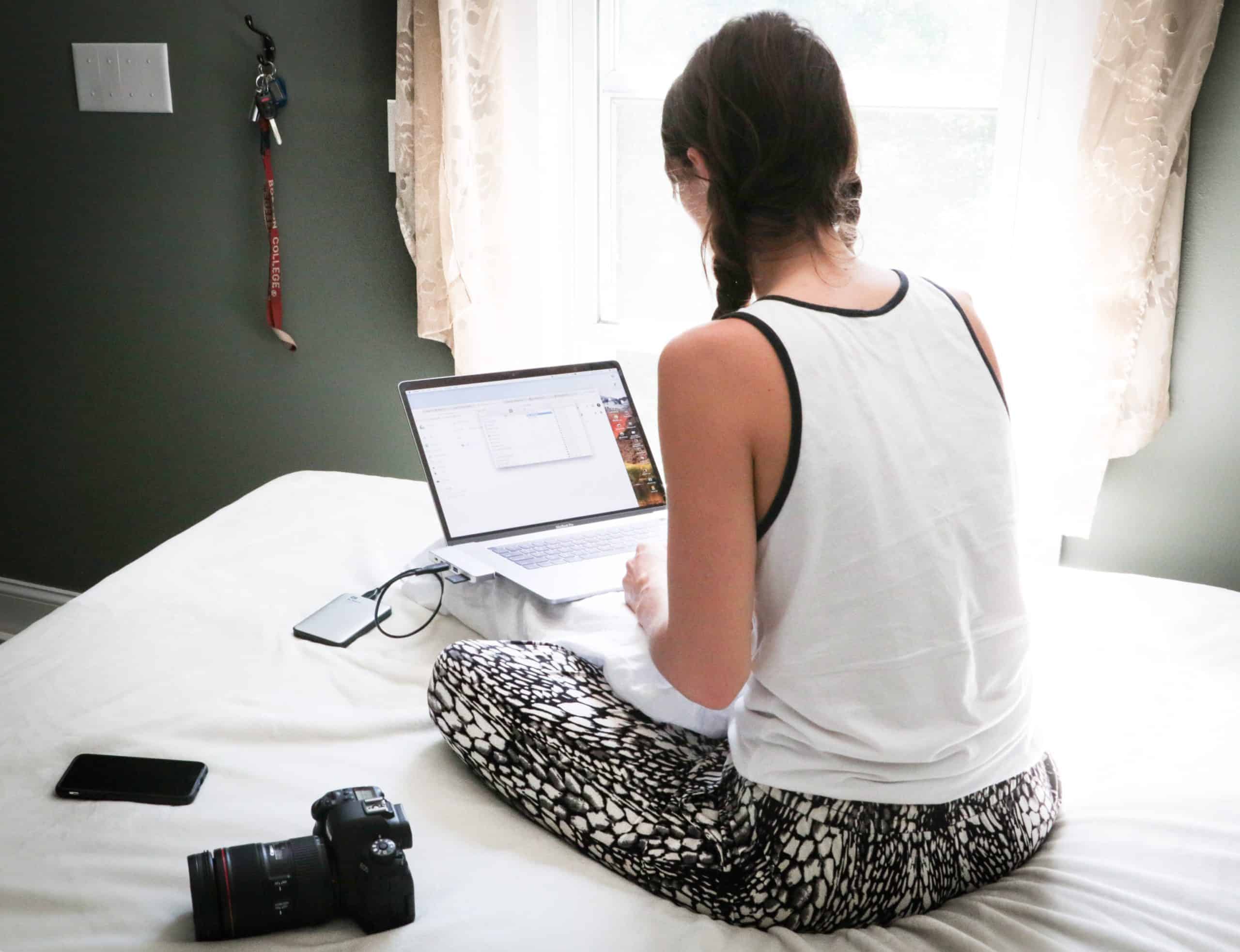 Girl with laptop working remotely