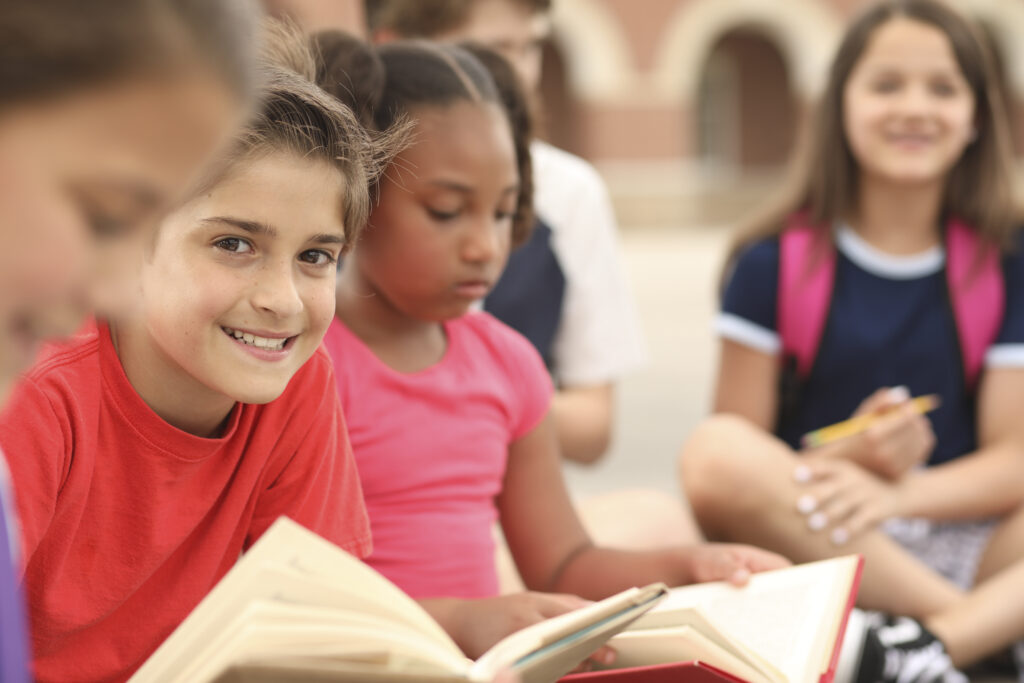 Children in a classroom reading.
