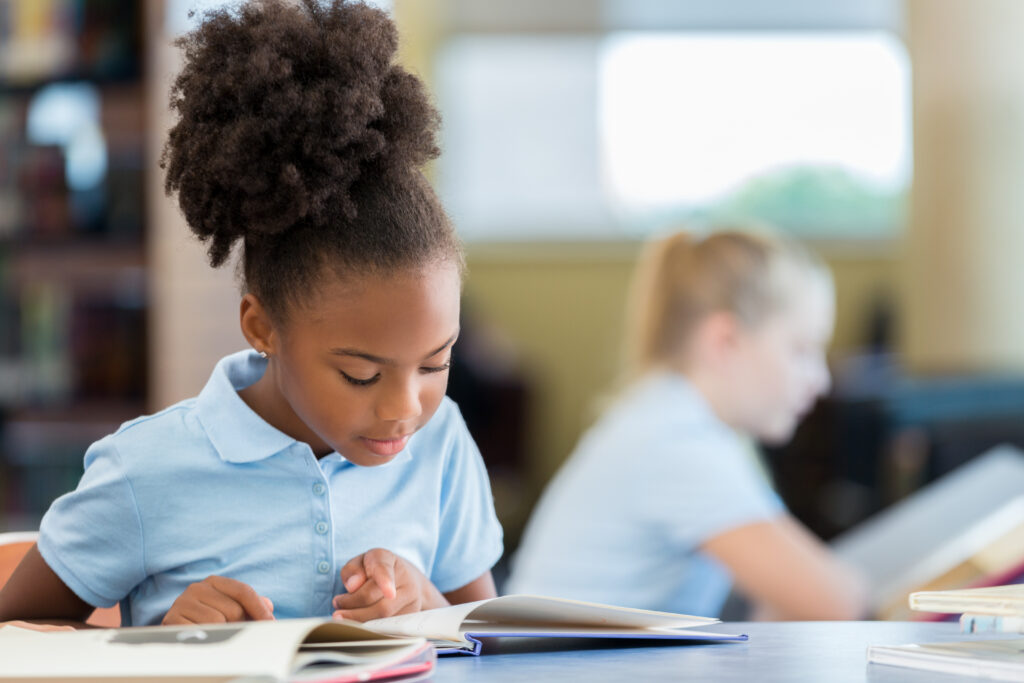Girl reading in class