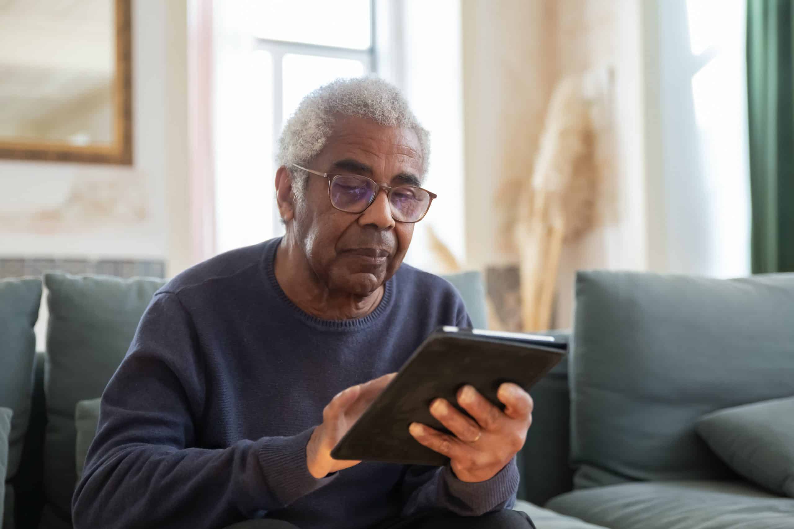 Senior using tablet