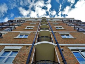 Ground-level perspective looking up at apartment building